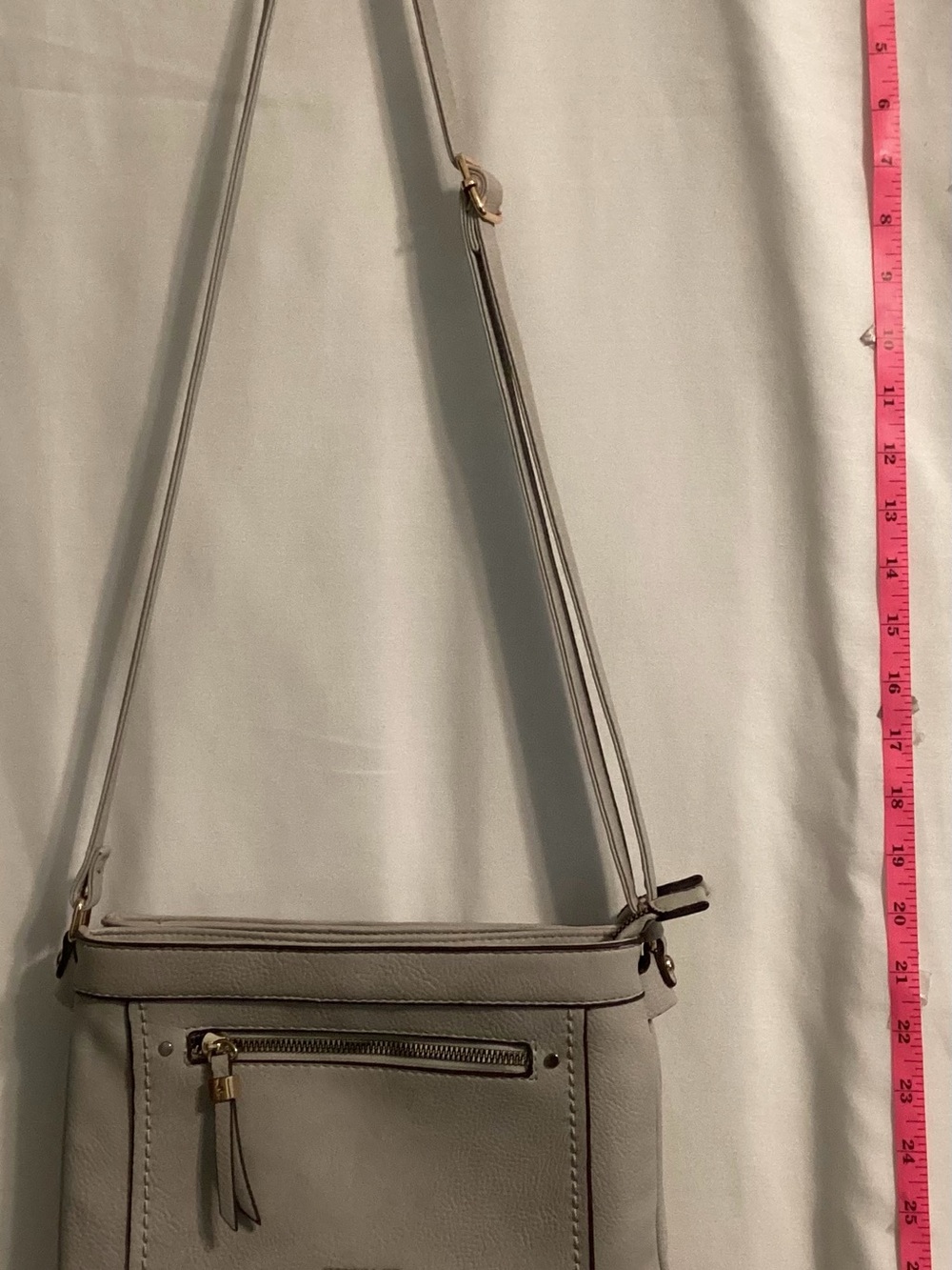 Gussaci faux vegan leather crossbody/Purse in  neutral gray . Bag has adj handle
